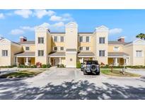 Charming building exterior with well-maintained landscaping and convenient parking at 1322 Seven Eagles Ct # 301, Reunion, FL 34747