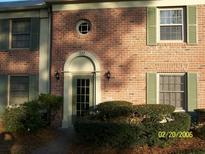 Charming townhouse with a brick facade, green shutters, and a well-maintained front entrance at 222 Georgetown Dr # C, Casselberry, FL 32707