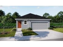 Charming single-story home with a two-car garage and well-manicured lawn at 2791 San Marco Way, Winter Haven, FL 33884