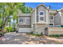 Charming two-story townhouse featuring an attached garage and mature landscaping at 796 Mcintyre Ave, Winter Park, FL 32789