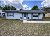 Charming single-story home featuring a well-maintained front yard and a welcoming entrance, enhancing its curb appeal at 14796 Sw 39Th Cir, Ocala, FL 34473