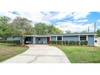 Charming one-story home with a well-manicured lawn and inviting curb appeal at 2707 Prince John Rd, Winter Park, FL 32792