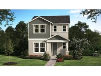 Charming two-story home featuring gray siding, a covered entry, and a well-manicured front lawn at 225 Station Ln, Debary, FL 32713