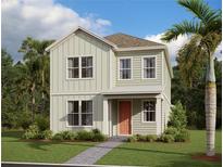 Inviting two-story home with a welcoming front porch and beautiful landscaping at 2963 Embark Trail, St Cloud, FL 34771