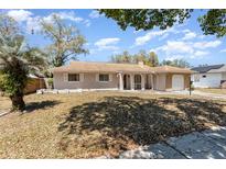 Charming home with a well-maintained front yard and covered entryway at 4723 Cherokee Rose Dr, Orlando, FL 32808