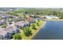 Beautiful waterfront townhomes featuring a community pool and lush landscaping, all with lake access at 8997 Lee Vista Blvd # 2009, Orlando, FL 32829