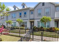 Charming townhome featuring well-maintained landscaping and a welcoming entrance at 1123 Mahonia Ct, Lake Mary, FL 32746