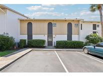Condo exterior with parking, updated facade, manicured hedges, and convenient unit numbers at 200 Maitland Ave # 52, Altamonte Springs, FL 32701