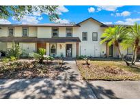 Inviting townhome with a well-maintained yard and charming curb appeal at 237 S Wilderness Pt, Casselberry, FL 32707