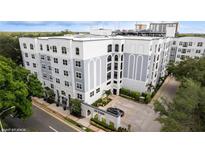 Elegant building exterior showcasing landscaped entrance and architectural details at 300 E South St # 6003, Orlando, FL 32801