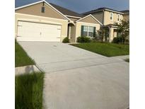 Charming single-Gathering home featuring a spacious driveway and a two-car garage at 507 Short Ln, Winter Haven, FL 33881
