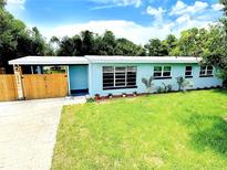 Charming single-story home with a well-maintained lawn and a welcoming, light-blue exterior at 511 S Alder Ave, Orlando, FL 32807