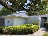 Charming single-story home with neutral stucco, mature landscaping, and inviting curb appeal beneath a mature shade tree at 567 E Orange St # 567, Altamonte Springs, FL 32701