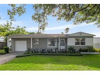 Charming single-story home with well-maintained lawn and landscaping at 715 Braidwood Ln, Orlando, FL 32803