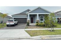 Charming single Gathering home with a two-car garage and beautiful landscaping at 1412 Brentwood Dr, Kissimmee, FL 34746