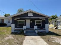 Charming single-story home with a welcoming front porch and freshly painted exterior at 232 S Clara Ave, Deland, FL 32720