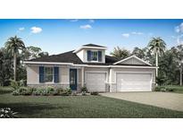 Beautiful single-story home showcasing a well-manicured lawn, stone accents, blue shutters, and an attached three car garage at 3499 Douglas Fir Dr, Apopka, FL 32703