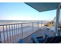 Relax on the private balcony, complete with seating, offering stunning oceanfront views of the beach at 5203 S Atlantic Ave # 416B, New Smyrna Beach, FL 32169
