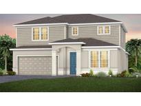 Charming two-story home featuring a blue front door, neutral siding, and attached two-car garage at 5604 Wood Bridge Pl, St Cloud, FL 34771