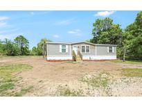 Charming single-story home featuring a well-maintained yard and a classic design at 9055 Atlas Dr, St Cloud, FL 34773