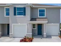 Charming two-story home with attached two-car garage and a welcoming front entrance at 2252 Tay Wes Dr, St Cloud, FL 34771