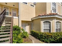 Inviting exterior view of unit 102 with well-manicured landscaping at 676 Sandy Neck Ln # 102, Altamonte Springs, FL 32714