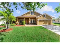 Charming single-Gathering home featuring a well-manicured lawn and attached two car garage at 3281 Pawleys N Loop, St Cloud, FL 34769