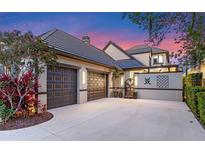 Charming home with a large three-car garage and meticulously maintained landscaping and a tile roof at 9624 Bryanston Dr, Orlando, FL 32827