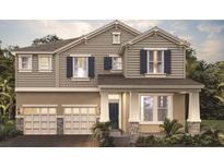 Charming two-story home featuring a 2-car garage, neutral siding, and inviting curb appeal at 16195 Point Rock Dr, Winter Garden, FL 34787