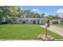 Charming single-story home featuring a well-maintained lawn and a classic mailbox for added curb appeal at 132 W Lauren Ct, Casselberry, FL 32730