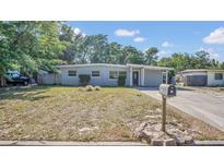 Charming single-story home with a well-maintained front yard and classic architectural details at 132 W Lauren Ct, Casselberry, FL 32730