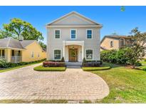 Charming two-story home with landscaped front yard and inviting brick paver driveway at 1341 Lyndale Blvd, Winter Park, FL 32789
