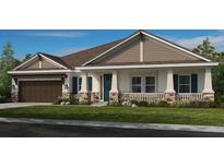 Charming single-story home featuring stone accents, a covered porch, and well-manicured lawn at 2963 Arranmore Dr, Ormond Beach, FL 32174
