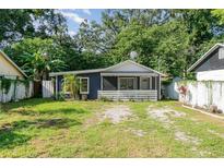 Charming single-story home with a cozy front porch and well-maintained lawn at 1506 37Th St, Orlando, FL 32839