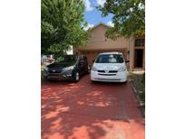 Charming single-Gathering home featuring a spacious garage and neatly maintained lawn at 220 Abbotsbury Dr, Kissimmee, FL 34758