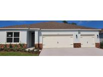 Charming single-story home featuring a three-car garage and well-maintained landscaping at 1032 Morfontaine St, Daytona Beach, FL 32124