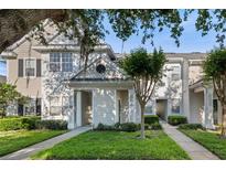 Charming two-story townhouse with manicured lawn and inviting walkway at 112 Southern Pecan Cir # 201, Winter Garden, FL 34787