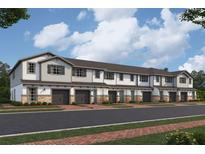 Charming townhomes feature attached garages, neutral colors, brick accents, and inviting entryways at 4291 Campsite Loop, Orlando, FL 32824
