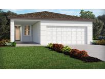 New construction home with an attached garage, a well-manicured lawn and colorful front yard landscaping at 4981 Kaia Ave, Winter Haven, FL 33884