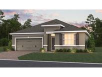 Charming one-story home with a paved driveway, attached garage, and well-manicured lawn at 738 Pointe Emerson Blvd, Apopka, FL 32703