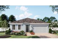 Charming single-story home with a two-car garage, light blue exterior, and beautifully landscaped front yard at 1822 Columbus Path, St Cloud, FL 34771