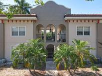Charming condo featuring a Mediterranean-style design with an inviting gated entrance and lush, mature landscaping at 702 E Church St # 3, Orlando, FL 32801