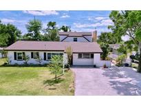 Charming two-story home featuring a well-manicured lawn and inviting front entrance at 712 Grandview Ave, Altamonte Springs, FL 32701