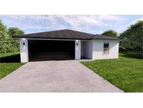 Charming single-story home with a modern design and a spacious two-car garage at 17445 Sw 25Th Ct, Ocala, FL 34473