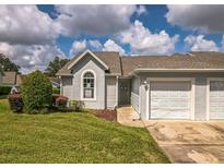 Charming home features a well-maintained lawn and attached one car garage at 2503 Se 18Th Cir, Ocala, FL 34471