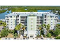Stunning waterfront condominium complex boasts manicured landscaping, covered parking, and access to coastal waterways at 5 Riverwalk Dr # 604, New Smyrna Beach, FL 32169
