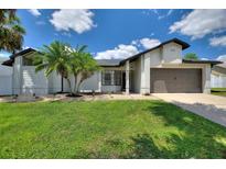 Well-manicured lawn and freshly mulched beds welcome you to this beautifully maintained home at 731 Rosemere Cir, Orlando, FL 32835