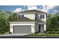 Charming two-story home showcasing a modern exterior, manicured landscaping, and a two-car garage at 1030 Teal Creek Dr, St Cloud, FL 34771