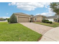 Charming single-story home features a spacious driveway and well-manicured lawn at 11725 Verrazano Dr, Orlando, FL 32836