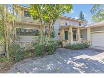 Charming two-story home with stone accents and a well-maintained front yard at 9222 Charles E Limpus Rd, Orlando, FL 32836